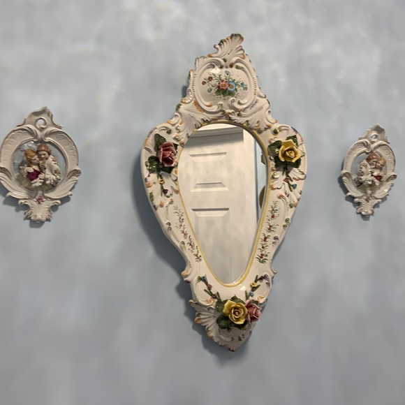 Porcelain mirror made in Italy 26”x 15”x4” plus 2 wall decorations 6”x9”
